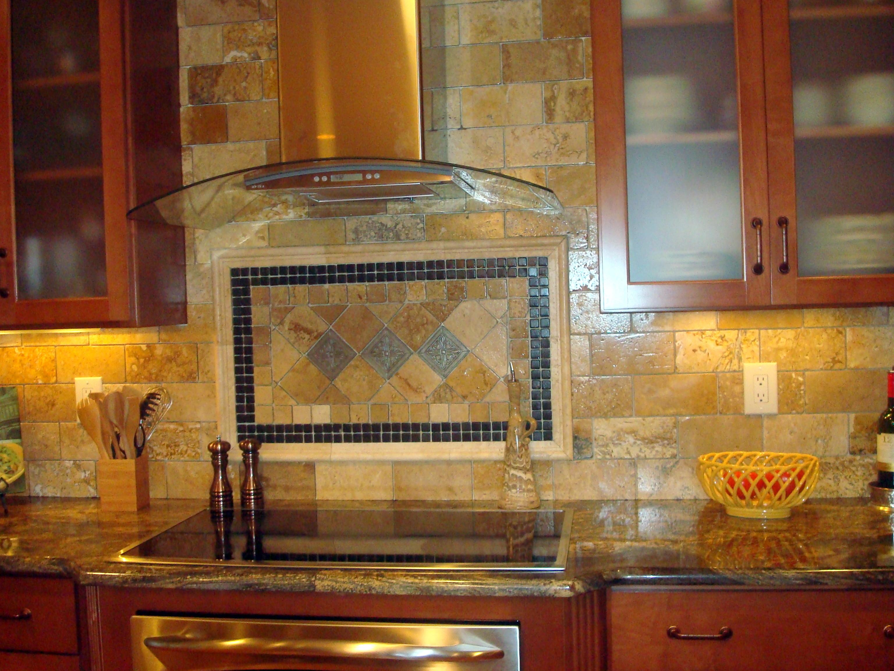 Custom tile backsplash and granite counters really pull this kitchen together!