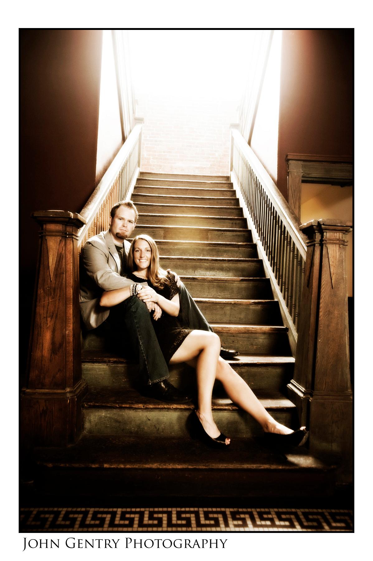 Couple on steps in old factory