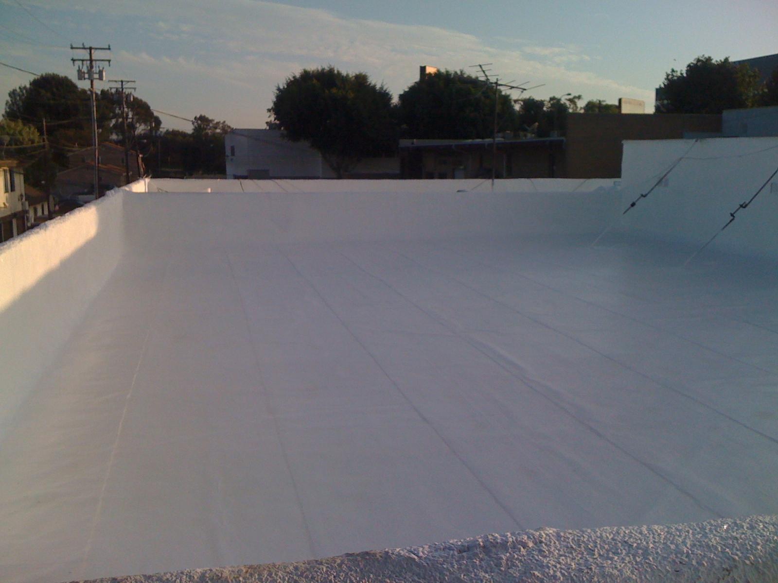 Modified emulsion roof, polyester fiber reinforced, elastomeric top coat