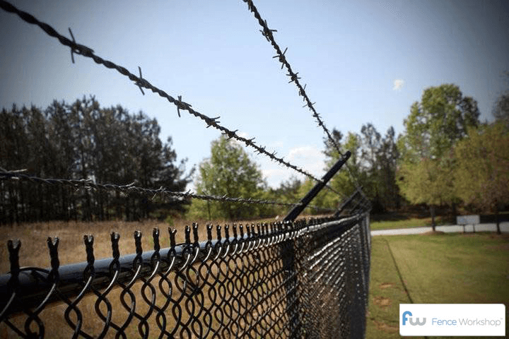 Commercial chain link fence with barbed wire