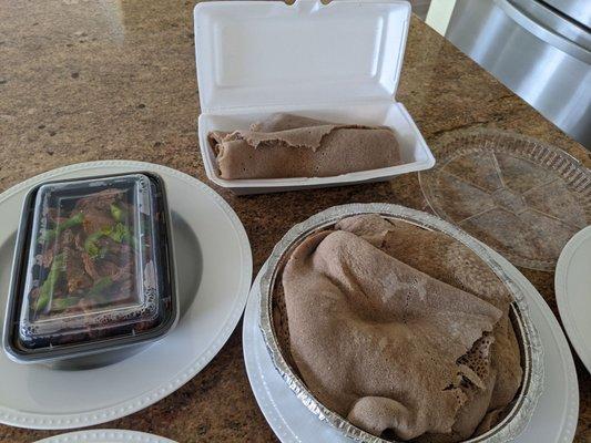 Got some take out!  Mogne Tibs, Veggie Combo, comes with side of injera