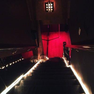 The stairs leading down to the one and only stage in this small and unique club.