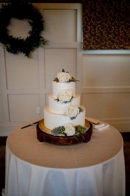 We asked Michael to place a few white roses and greenery on our cake - beautiful and simple!