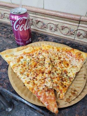 Two slices of pizza and a drink