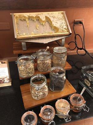 Honeycomb and topping selections for oatmeal on buffet