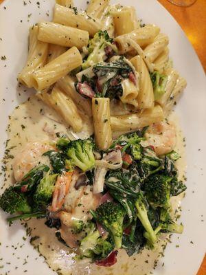 Shrimp chicken broccoli spinach, rigatoni in cream sauce.