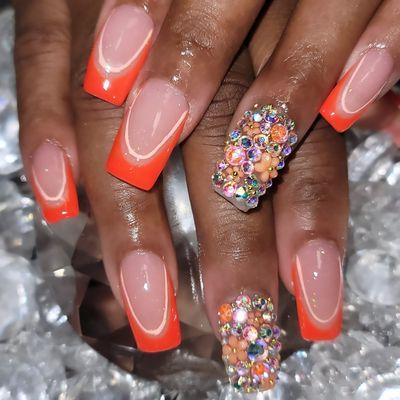 Full set of acrylic nails with freestyle nail art with rhinestones and flowers