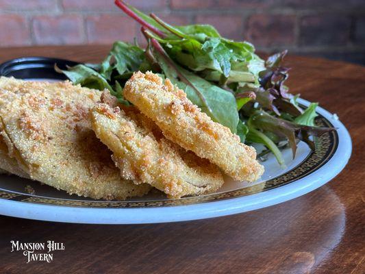 Fried Green Tomatoes with fresh greens and signature sauce