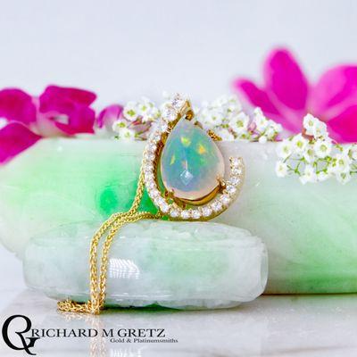 Ethiopian Opal pendant with lab diamond accents in 14kt yellow gold. The chain is sold separately.