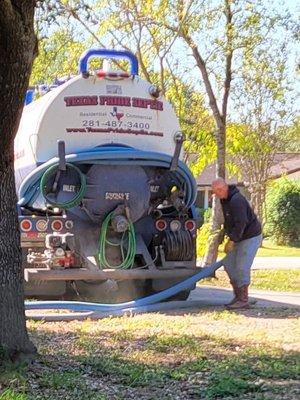 Taking the lines off the truck.