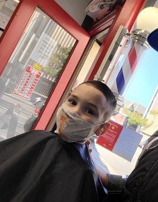 Handsome boy get a haircut by Van's.