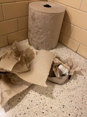 Overflowing trash in bathroom