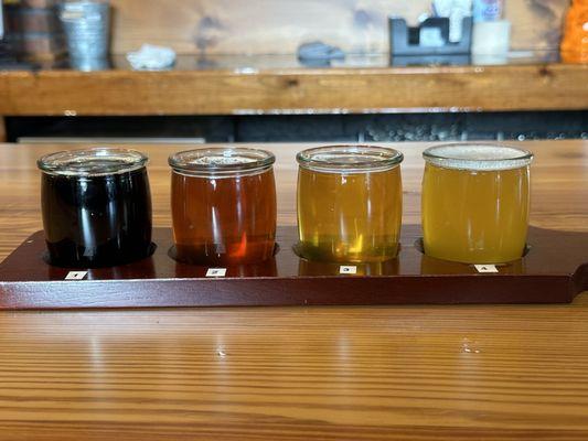 Flight of lager, amber, DIPA & stout.