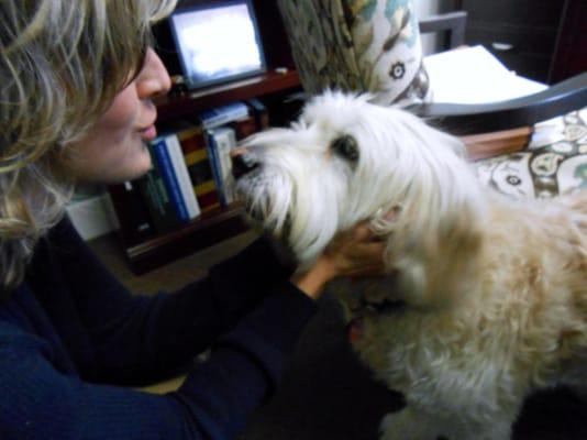 This is Attorney Stacy McCormack with Gracie, Attorney Suzanne Vetter Burnett's sweet dog on a recent visit to our office...