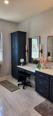 Classy dark navy cabinets.