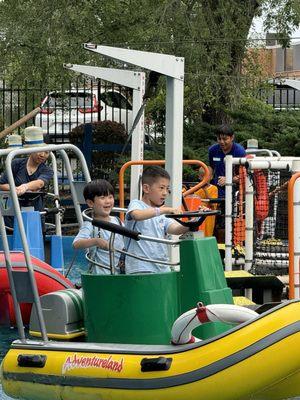 Ryan drives a speedboat with Matthew.