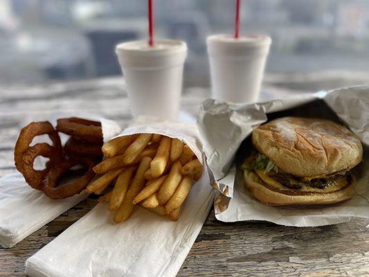 Double cheeseburger, fries, onion rings, peanut butter milkshake and strawberry/vanilla milkshake