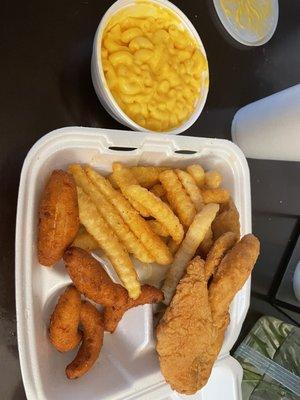 Medium tilapia with french fries hush puppies and mac & cheese