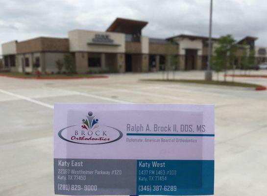 Exterior of Katy West location of Brock Orthodontics with business card