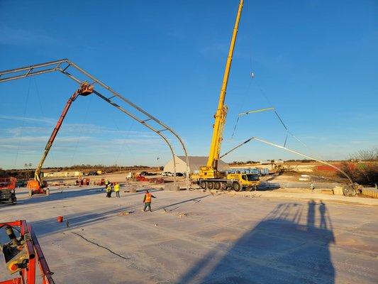 Using scissor lifts, boom lifts, and a mobile crane to put up a Sprung structure