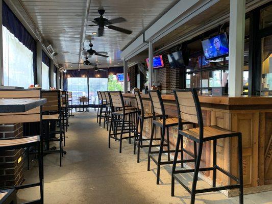 Outdoor seating with walls rolled down since it's raining. We loved sitting here but we were by ourselves on this rainy day.