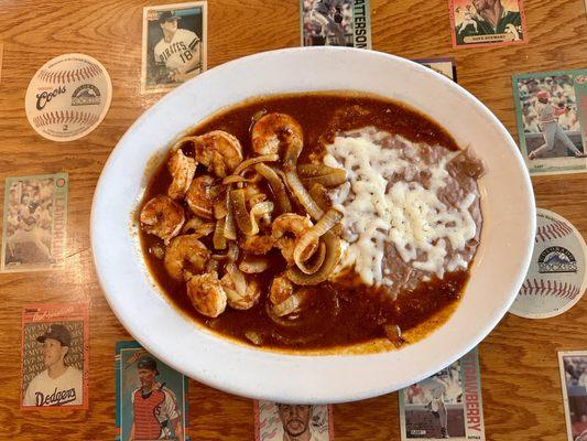 Camarones a la Diabla - shrimps in a chipotle sauce. Served with rice and beans and tortilla.