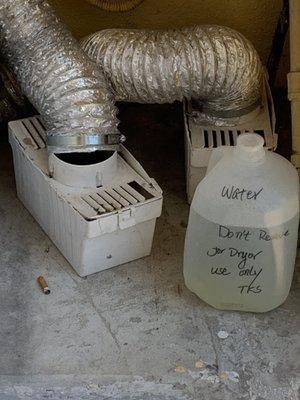 Laundry area. Unhooked vents and why do driers need a gallon of water?