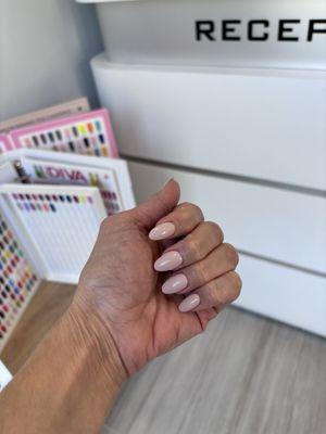 Nude polish on acrylics. Done by Tony.