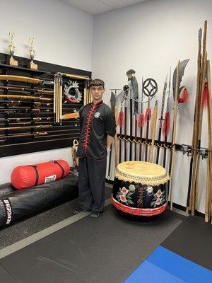 Instructor Max standing by ancient Chinese weapons used in weapons Training