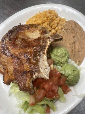 Pork Chop Plate 
Served with rice, beans, salad, guacamole and tortillas