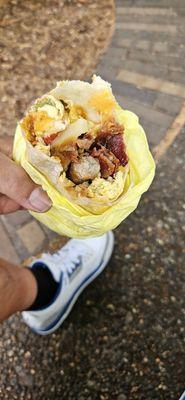 Bacon and sausage breakfast burrito.