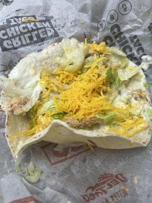 Chicken taco with watery sour cream