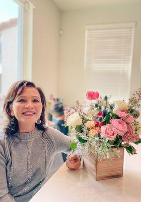 My mom with her beautiful "deep in the woods" floral arrangement.