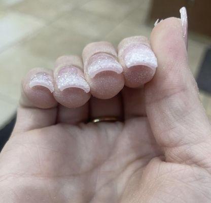 I asked for a simple French tip with glitter, and this is what she gave me