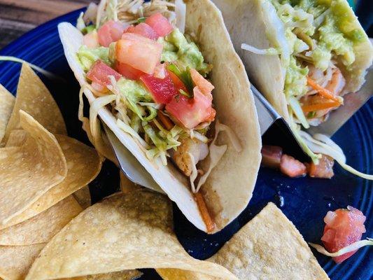 Shrimp Tacos. Delicious but the photo doesn't do them justice. Pay no attention to the bite already taken.