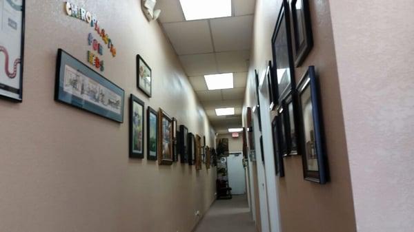 Plenty of therapy rooms and a hallway full of happy mma patient photos