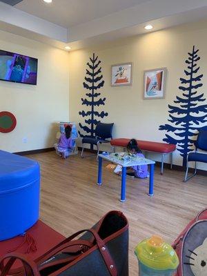 My daughters patiently waiting at the waiting area. Books and toys, all ready for the kids to play. Plus with cartoons playing on the tv.