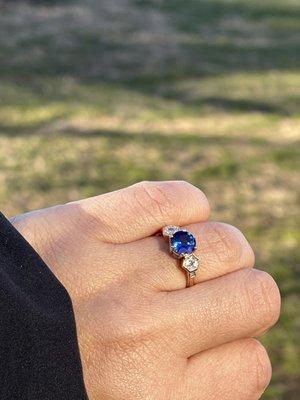 Custom designed engagement ring with sapphire and hexagon diamond as side stones