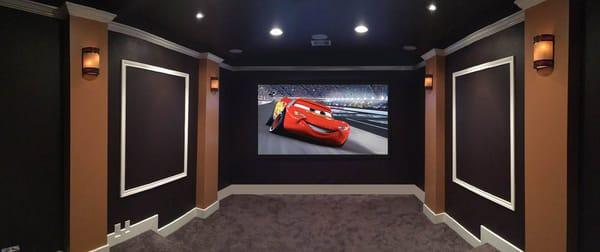 A former bedroom now showcases a nice home theater, we added seat riser, wall columns, bigger base board, crown molding, recessed lights...