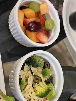 Homemade pasta and broccoli salad and fresh fruit