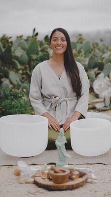 Holistic massage therapist with singing bowls in nature~