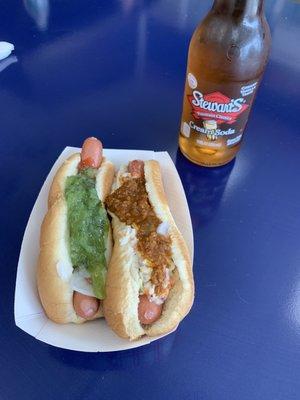 Dogs with ketchup, raw onion and relish and chili and slaw