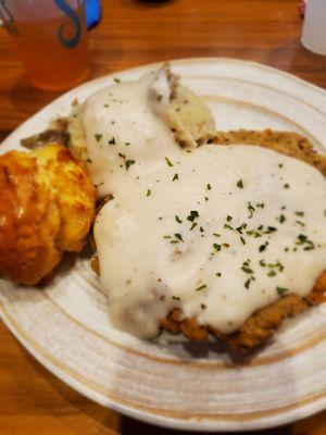 Chicken fried steak with whipped potatoes and honey biscuit