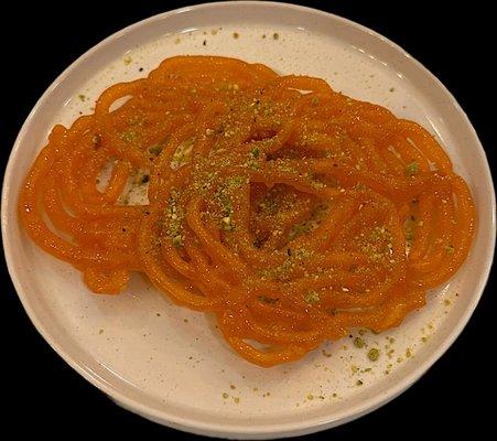 Jalebi :  Coil shaped donut, soaked in simple sugar syrup.