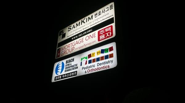 View of the sign at night on Beach Blvd.