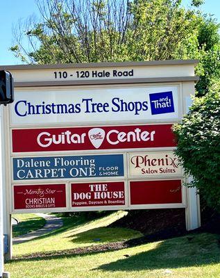 Signage - it's in the Christmas tree shop plaza, out back, behind guitar center