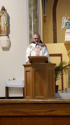 Father Thomas during mass.