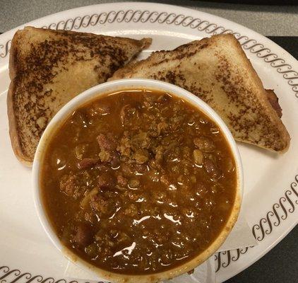 Cheese and bacon sandwich with side of chili