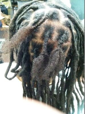 Stylist Joy repairing locs