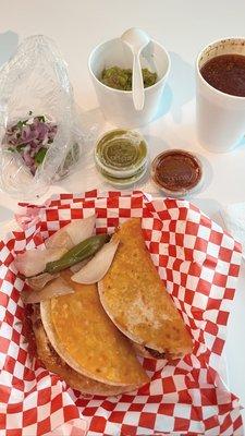 2 cheese tacos with a side of guacamole and a small consume. They provided complimentary onions/cilantro and salsa.